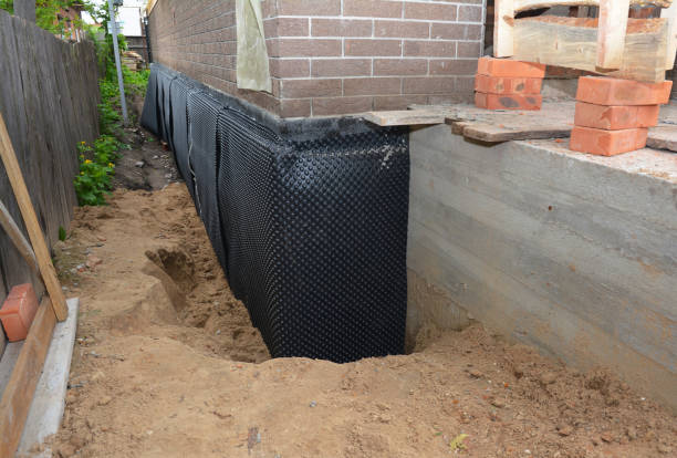 Happy homeowners after waterproofing job in Pemberville
